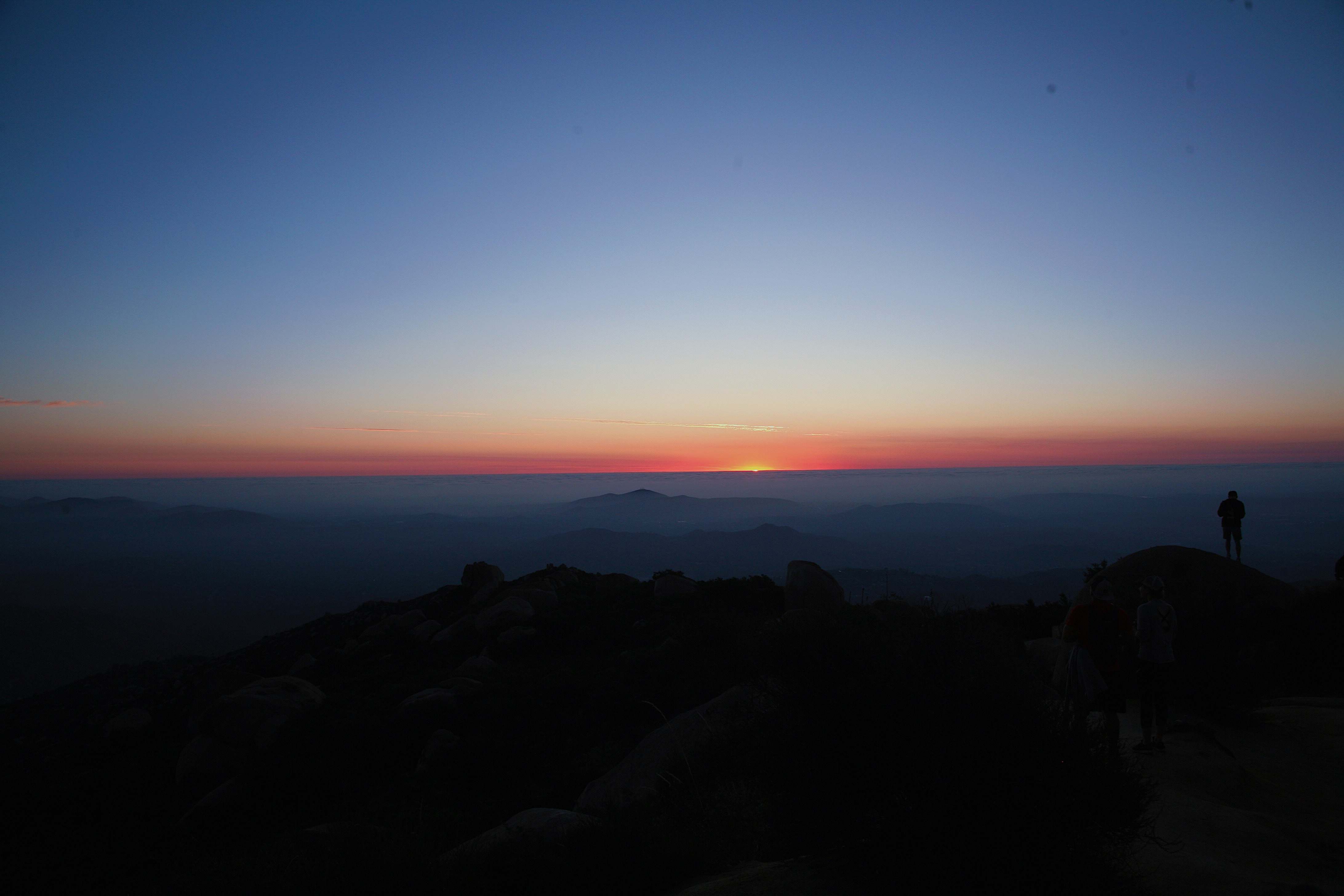 Sky Silhouette Of Person Standing On Cliff Sunset Image Free Photo