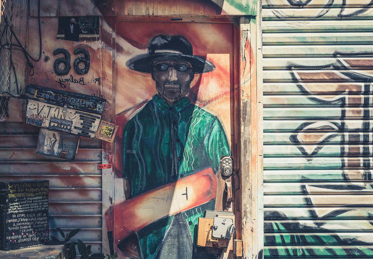 clothing man wearing green polo painting hat