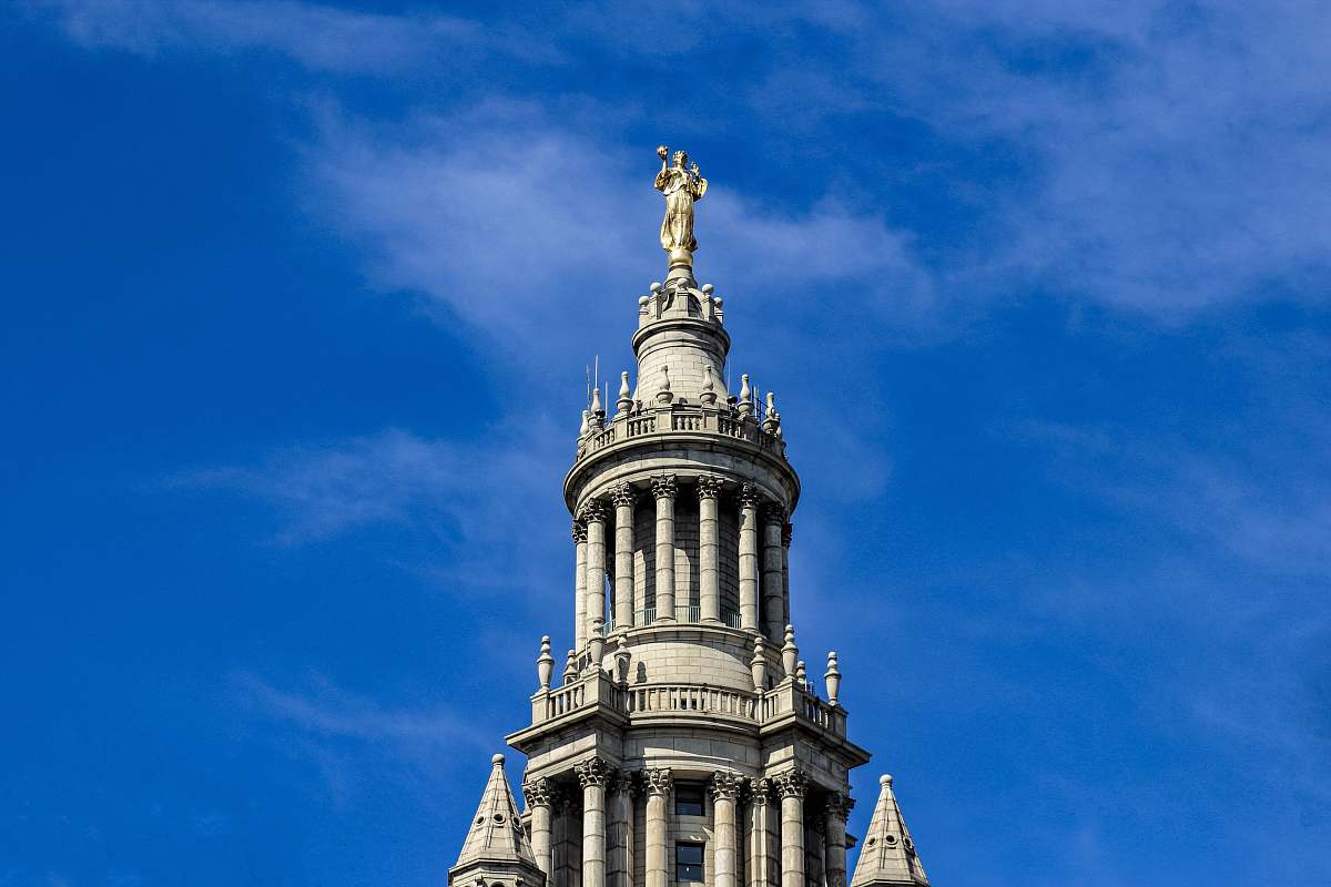 building white concrete building under blue sky during daytime new york city