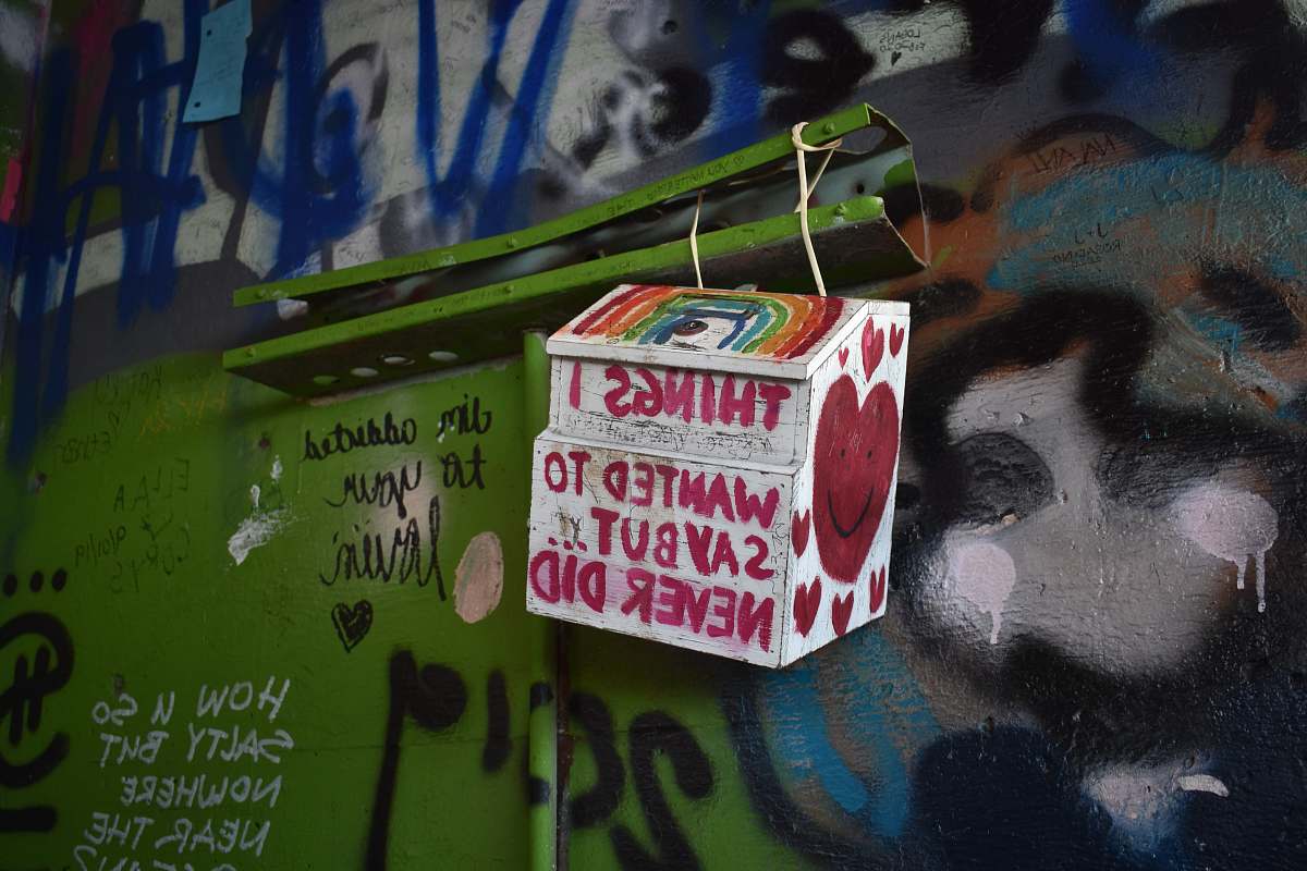 graffiti white and red labeled box mural