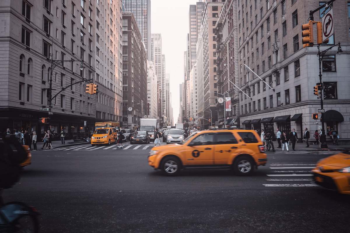 cab time lapse photography of running vehicles on road during daytime car