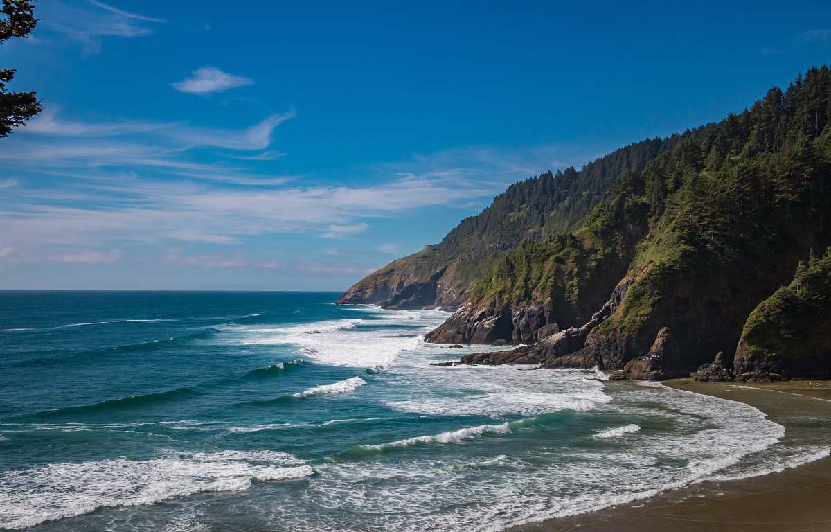 promontory seashore under blue sky coast