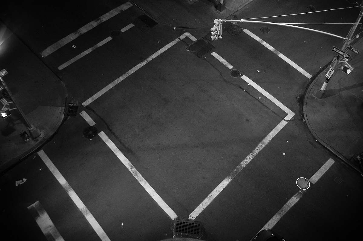 grey A look down at an empty intersection where traffic lines form a square new york