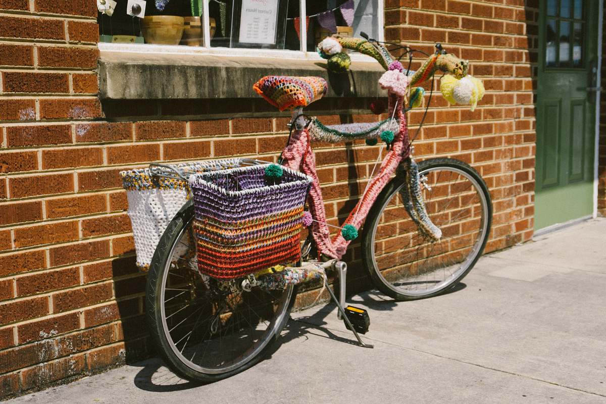 bicycle bike parked on brown concrete wall bike