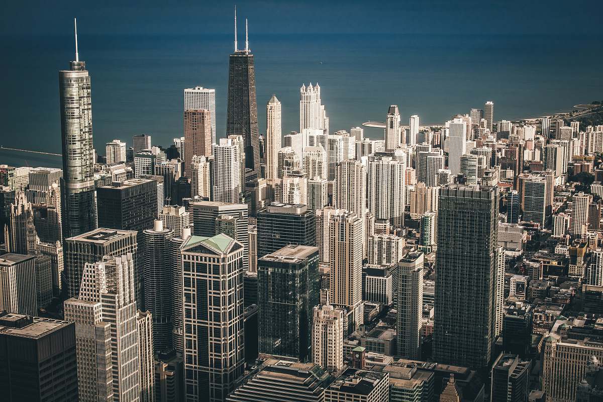city aerial view photography of city buildings near body of water downtown