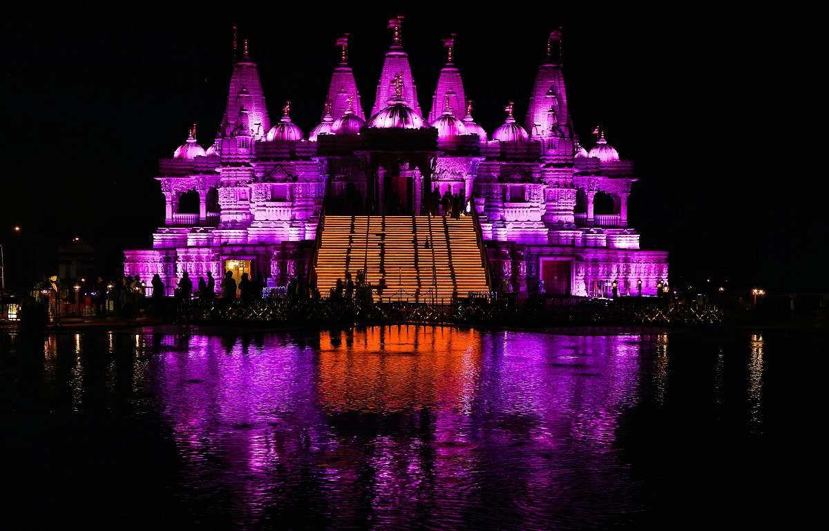 architecture building with pink and orange lights at night castle