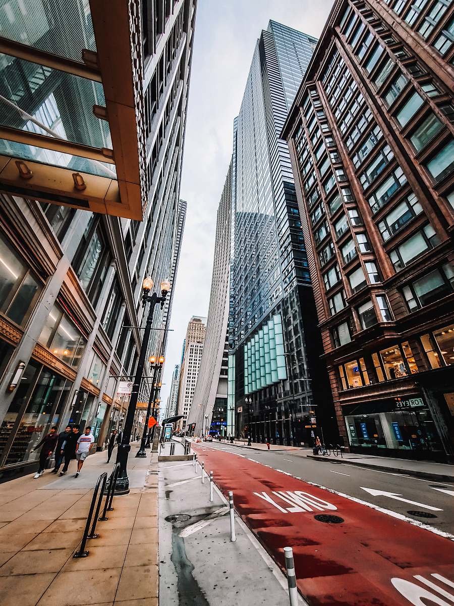 urban gray high-rise buildings beside road downtown