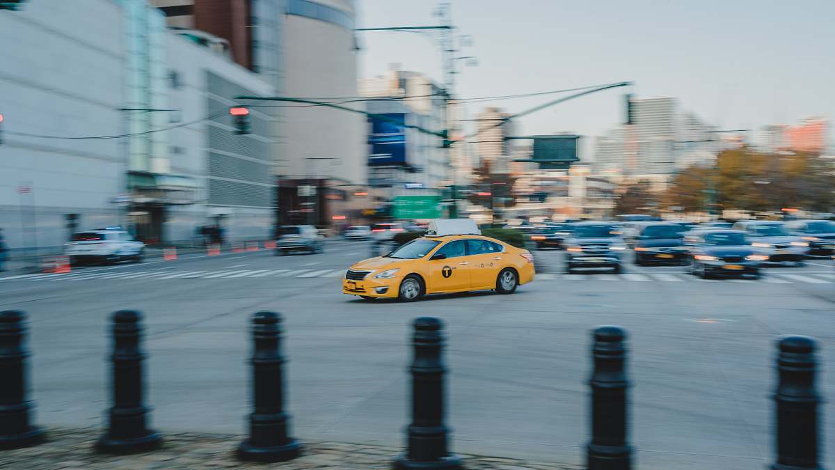 car yellow car crossing taxi
