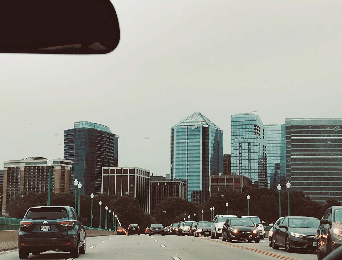 vehicle cars on road near high-rise buildings transportation