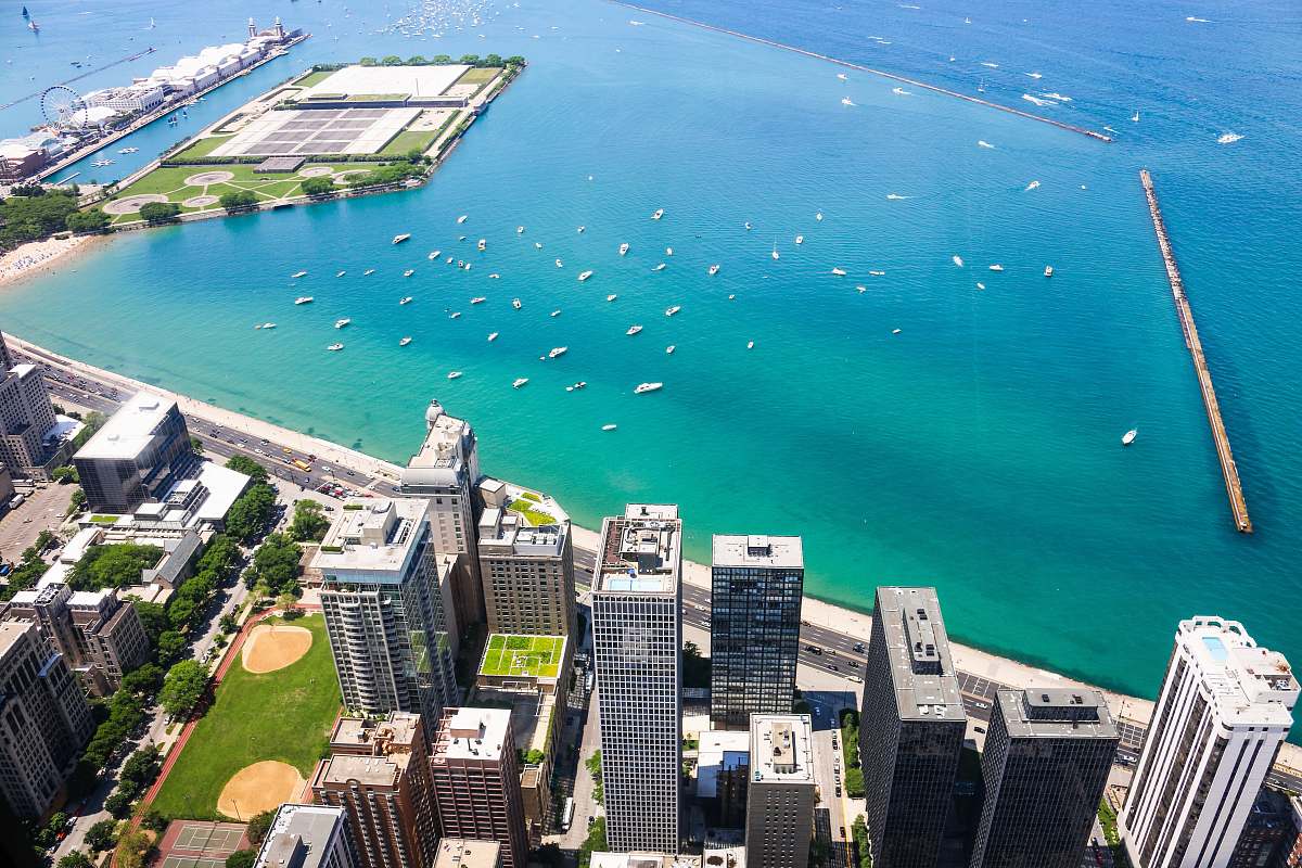 chicago aerial photo of cityscape beside teal calm body of water at daytime outdoors