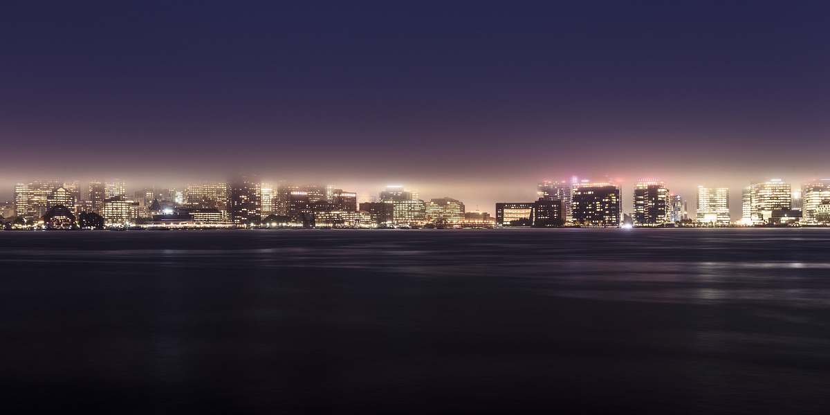 building cityscape by water urban