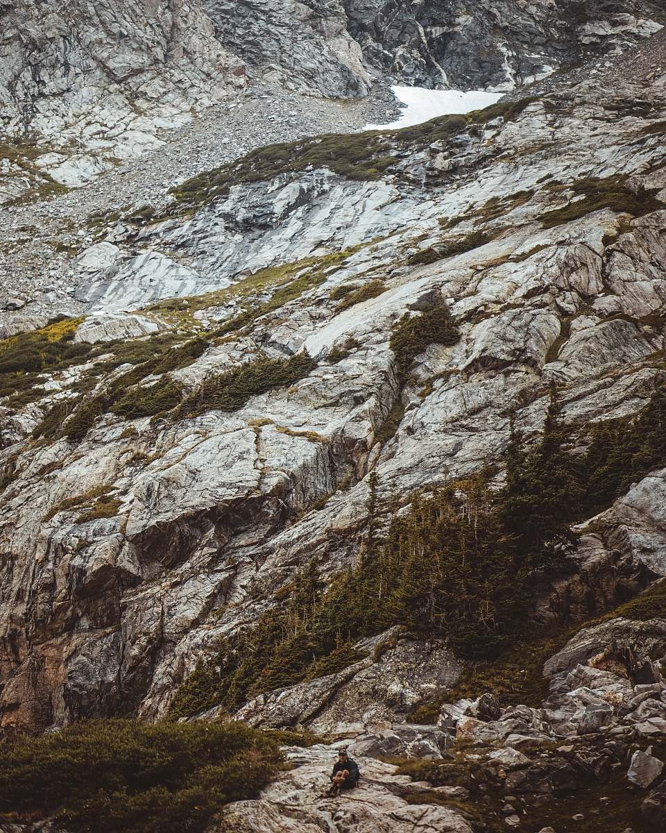 nature man by the side of a gray mountain outdoors