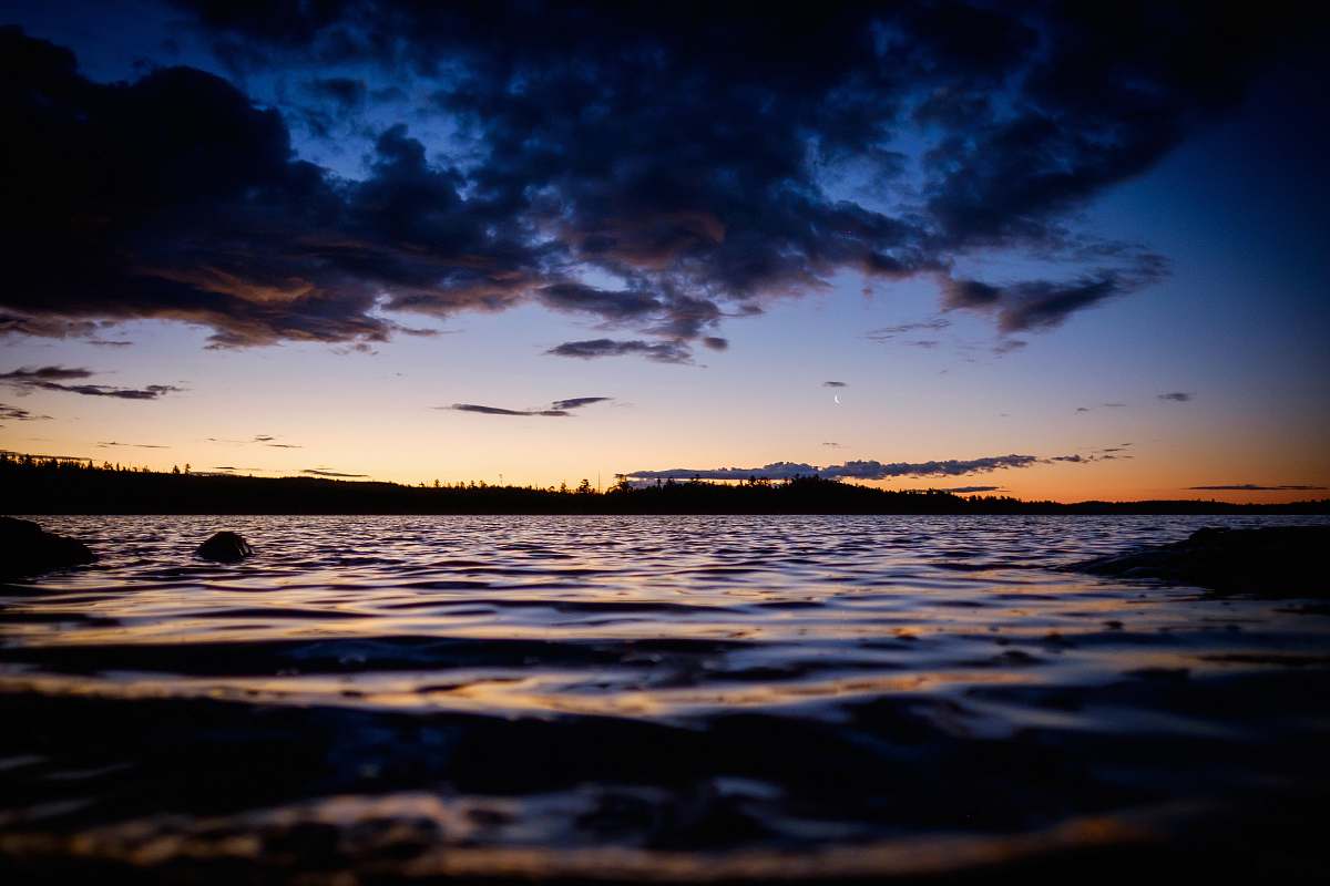 sunset aerial photography of body of water during golden hour dawn