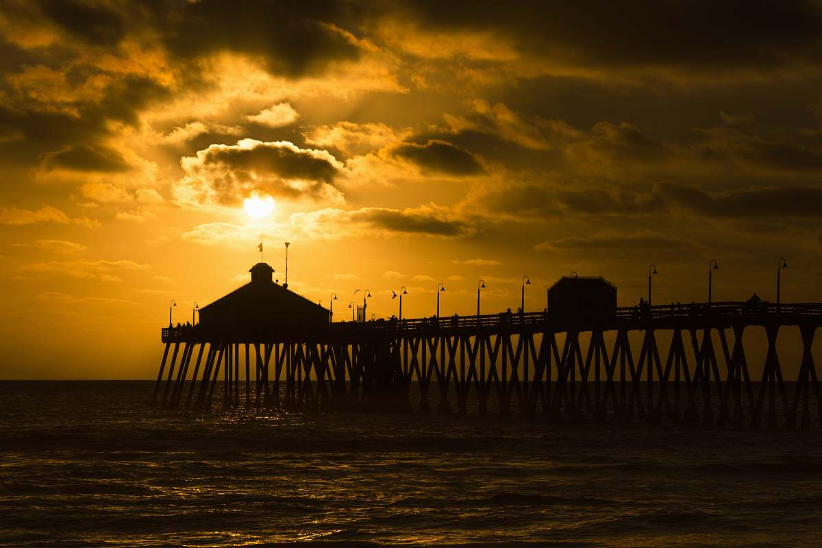 pier silhouette photo of sea dock at golden hour imperial beach