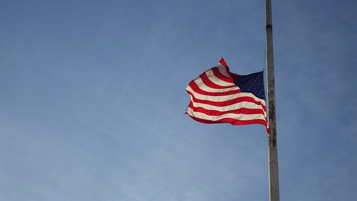 emblem America flag on pole pole