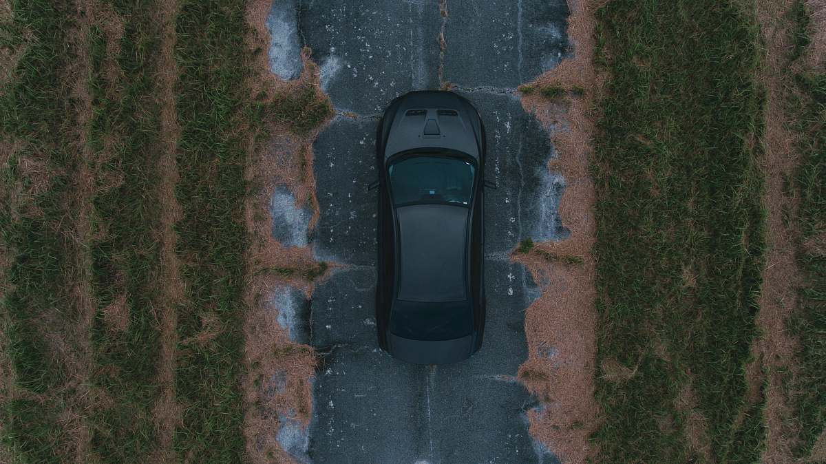 architecture black vehicle running on road bell tower