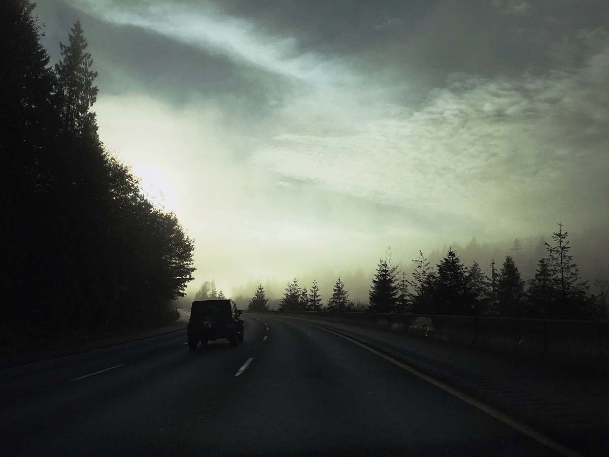 road car passing on road dirt road