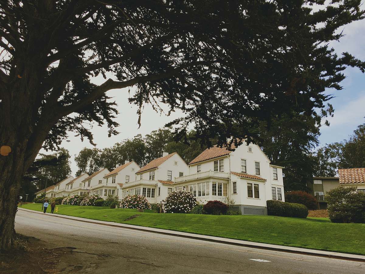 building people walking beside house and trees san francisco