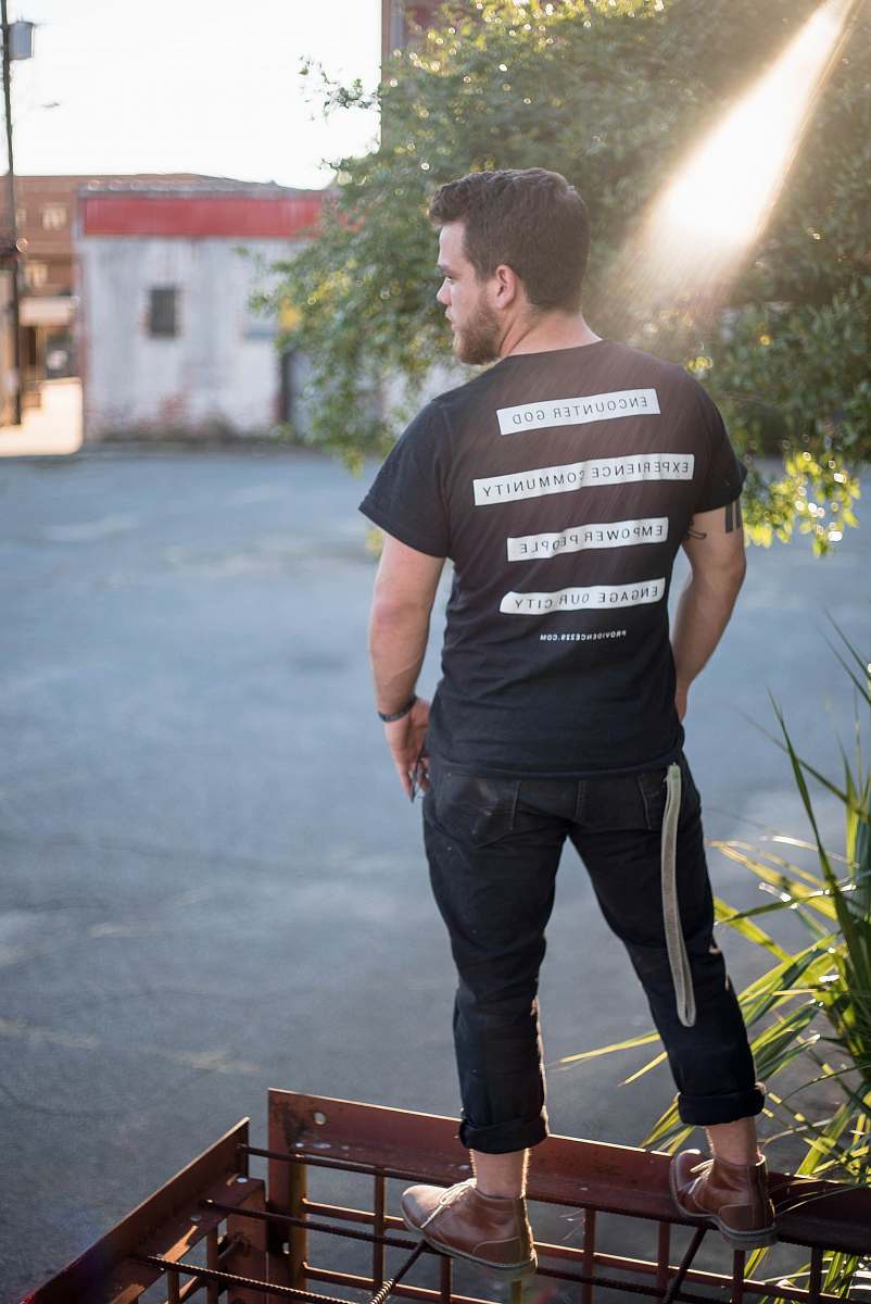 person man standing on brown wired platform clothing