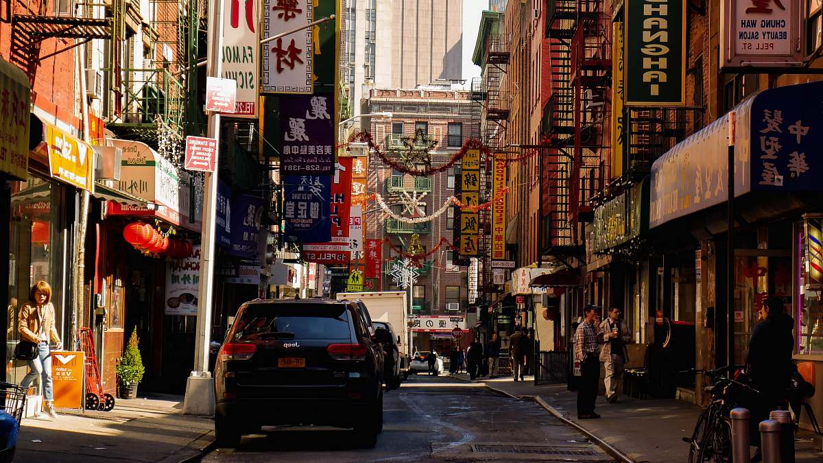 person people and cars in street automobile