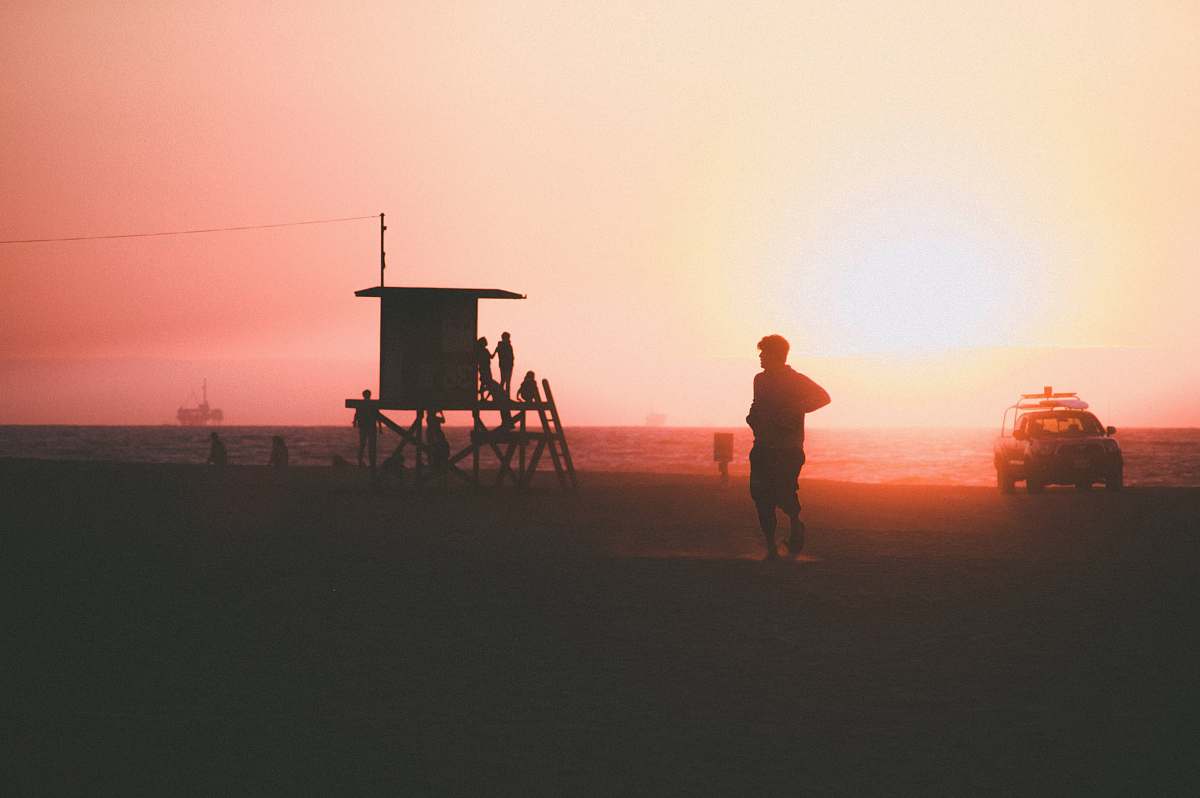person silhouette of person near car and beach automobile