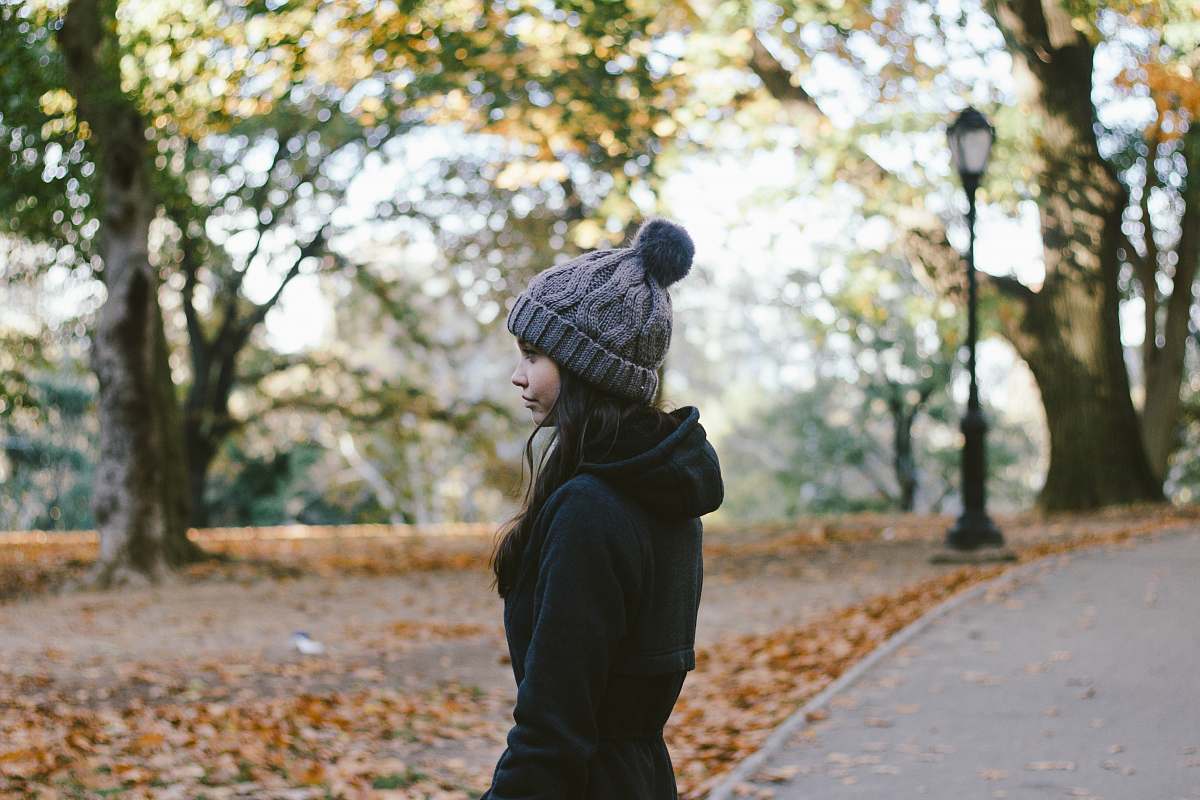 person woman standing near tree at daytime people