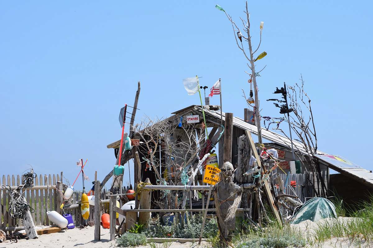 rural wooden house at beach during daytime nature