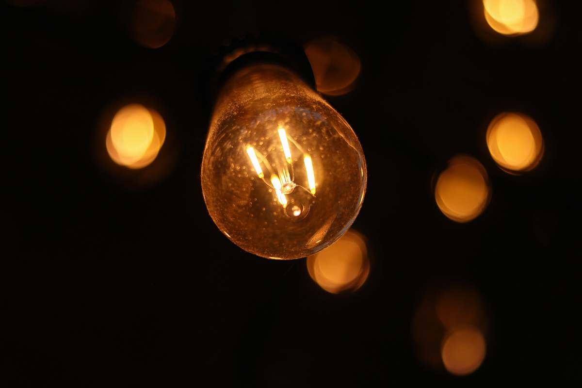 lightbulb bokeh lights photography of filament light bulb at night massachusetts