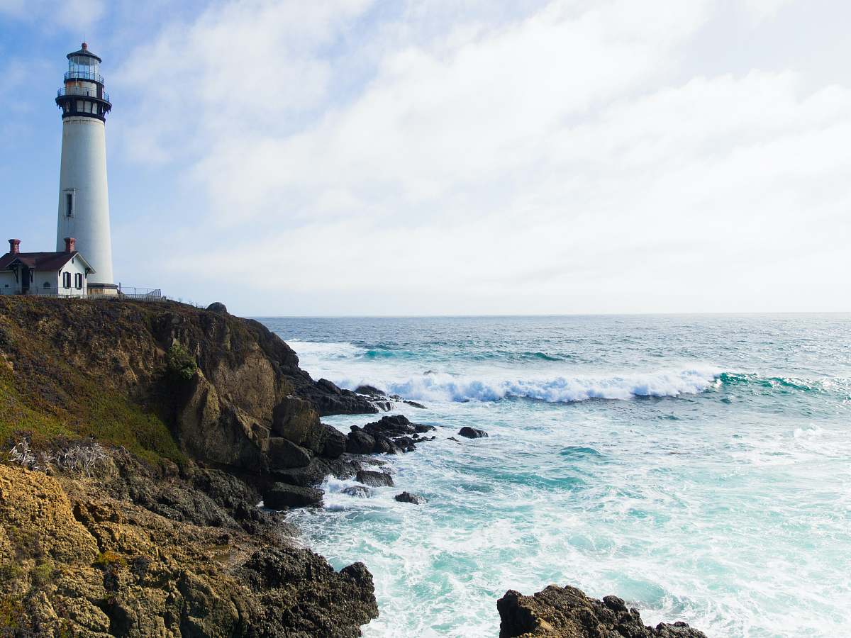 california photo of lighthouse on cliff beacon