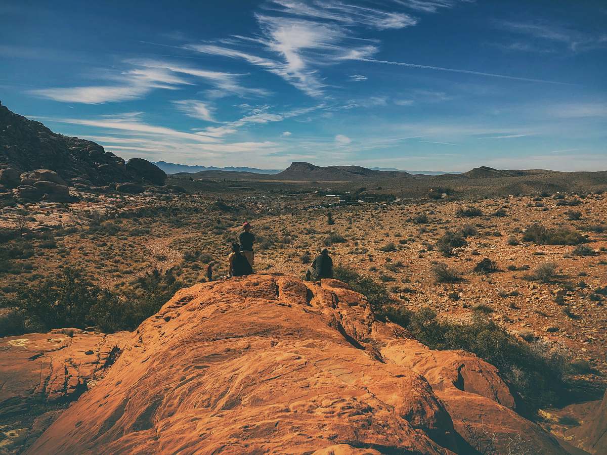 outdoors three men standing on rock formation nature