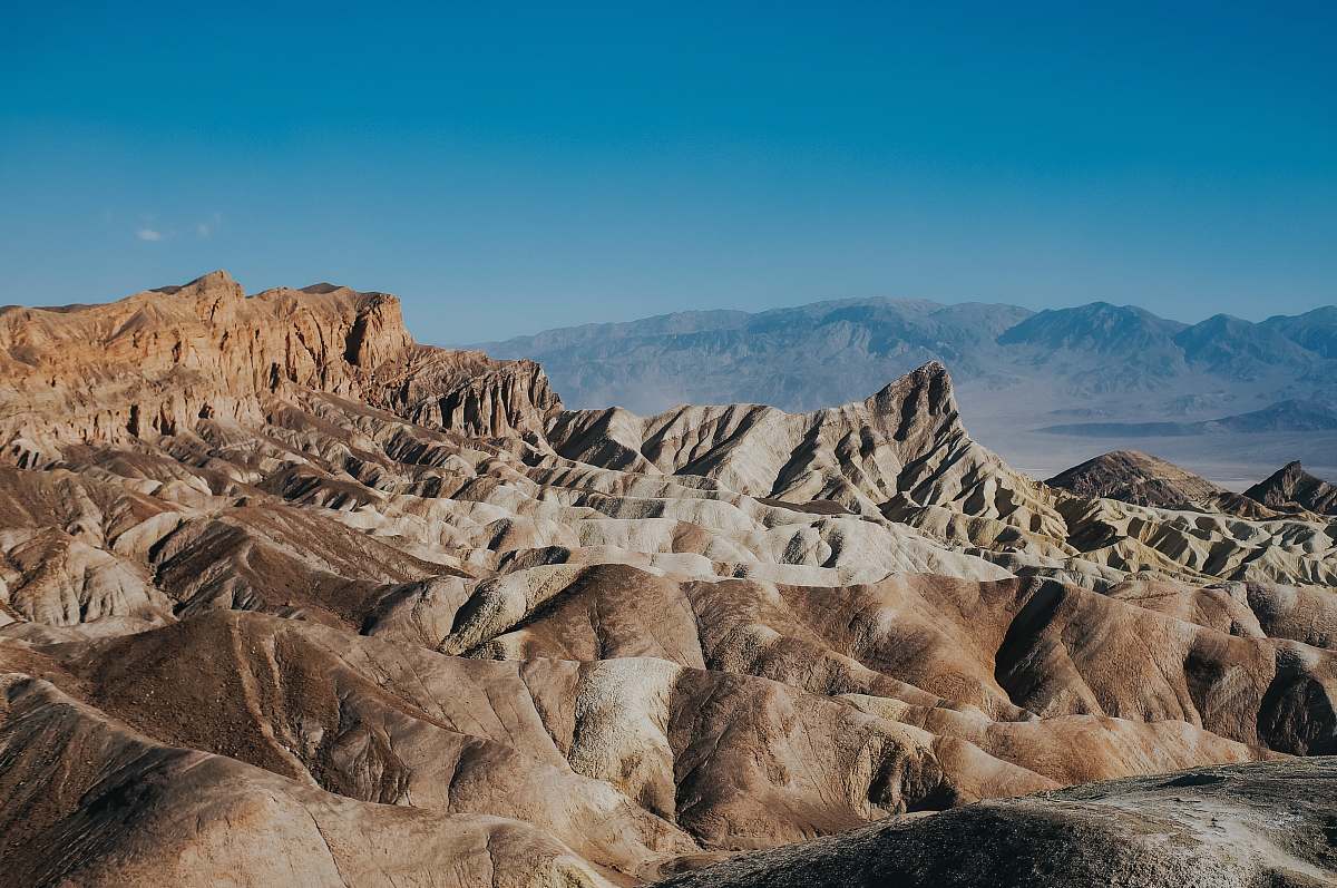 desert brown loess under clear blue sky mountain