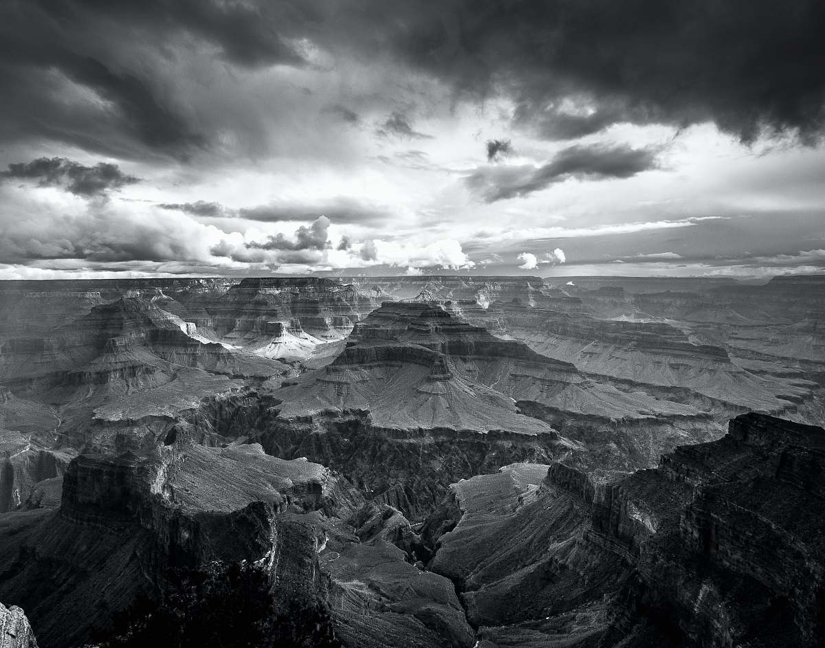 black-and-white landscape photo of grand canyon storm