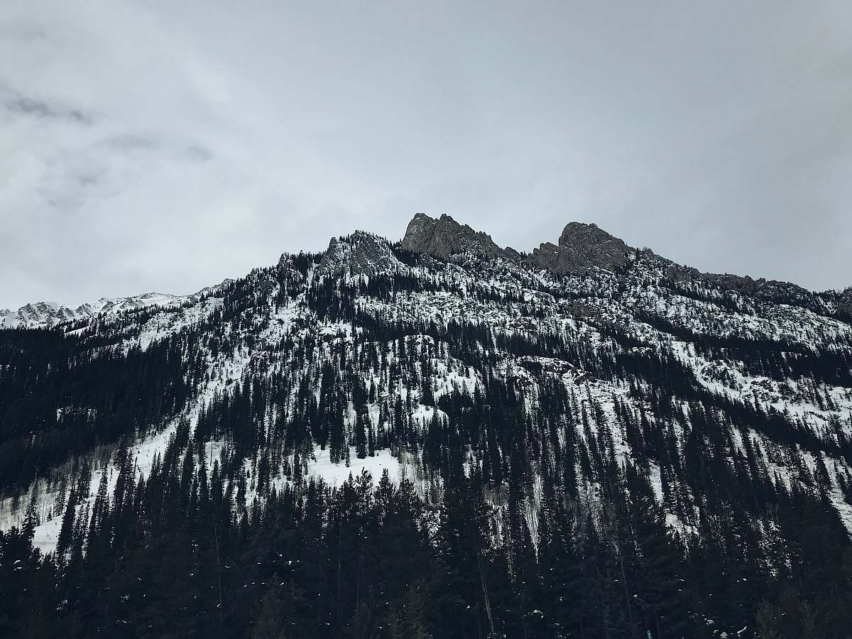 outdoors low angle photography of mountain during daytime mountain