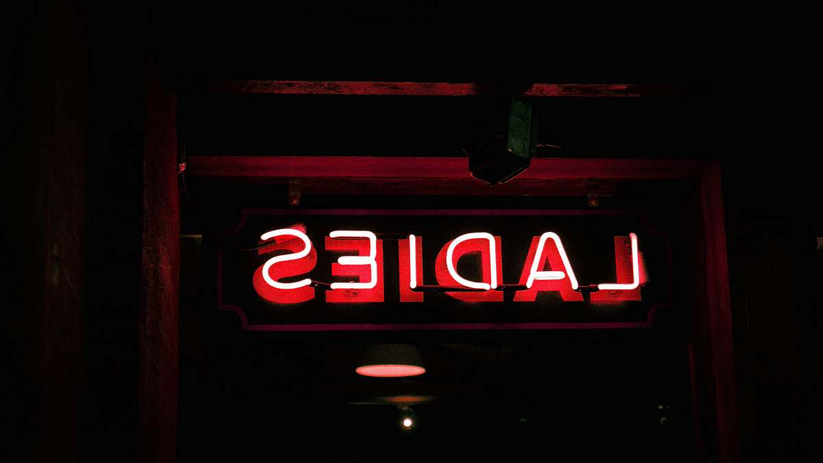 light red neon light signage chelsea market