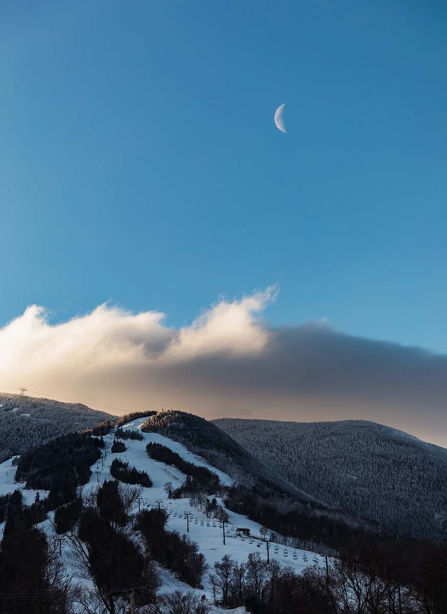 mountain snow and plant covered mountain under crescent moon during daytime blue