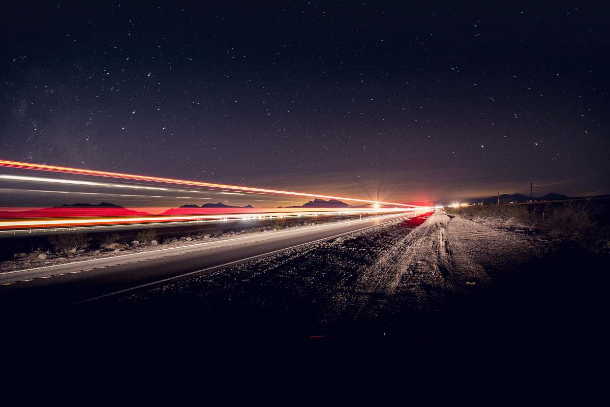 nature time-lapse photography of vehicles on road at night road