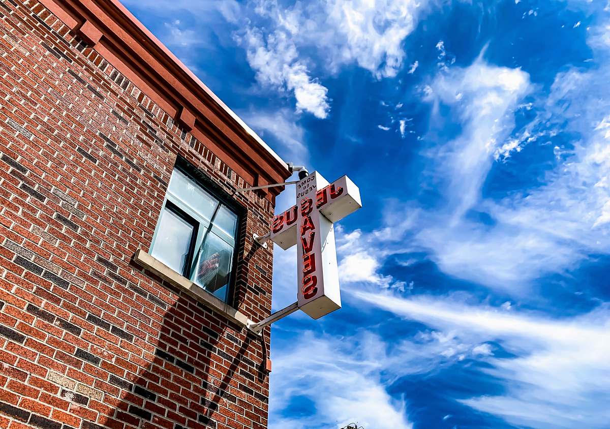 nature white Jesus Saves cross sign brick
