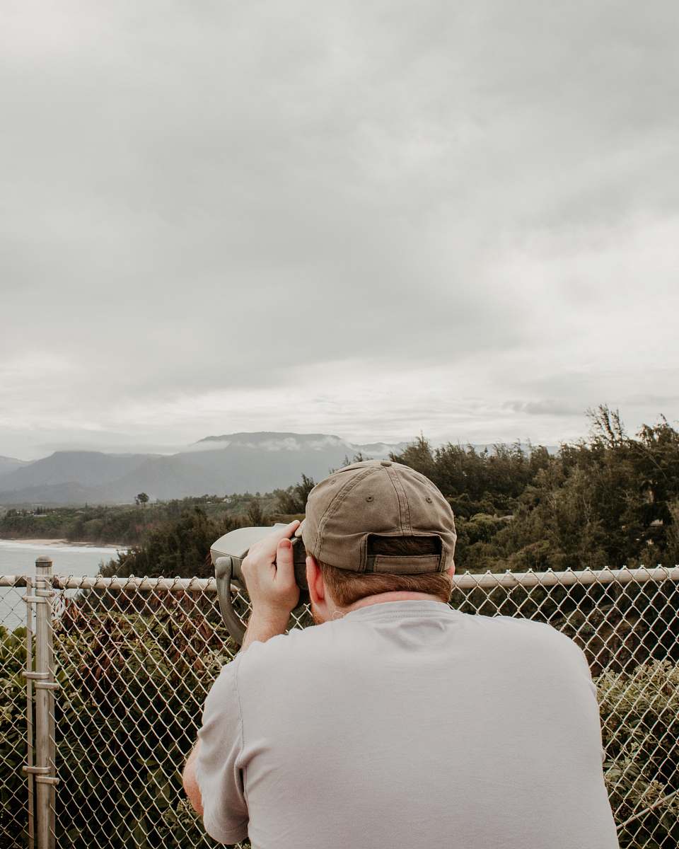 human man looking on coin telescope person