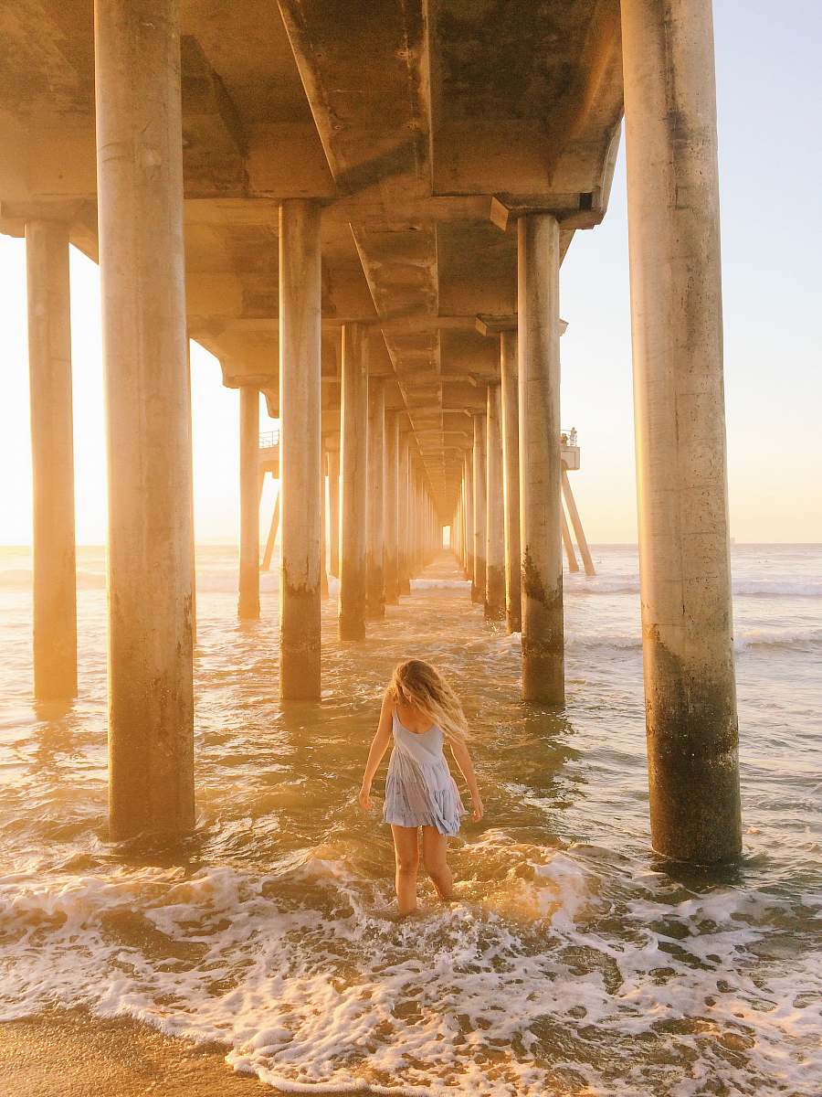 pier woman walking under dock dock