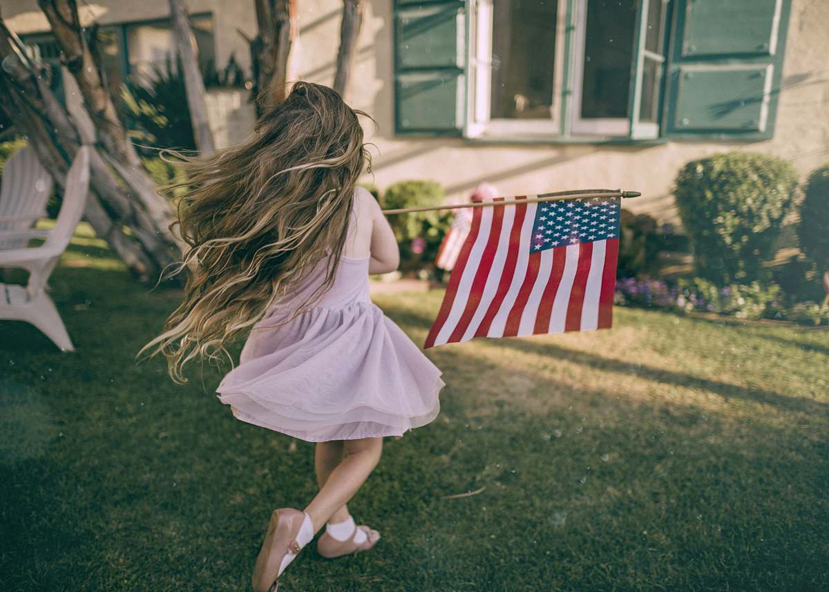 people girl holding flag of USA human