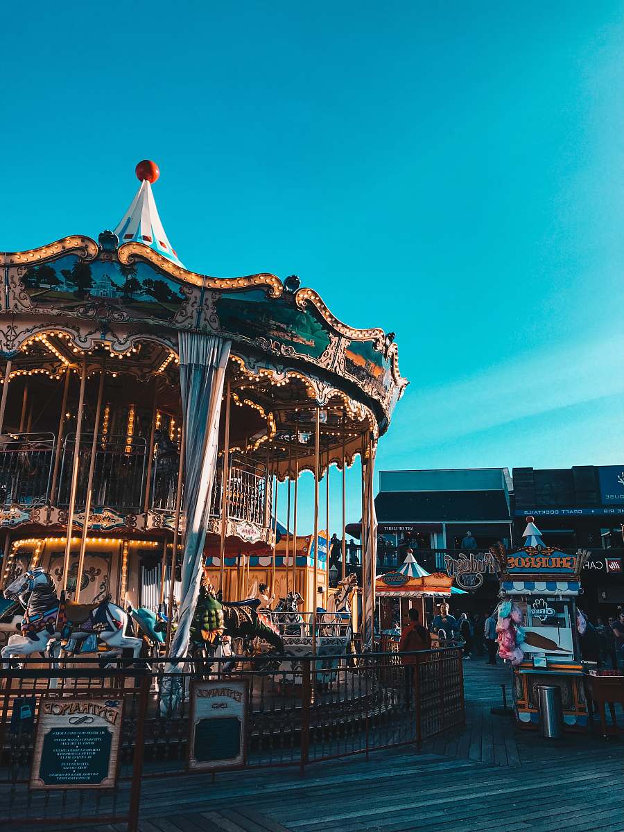 human gold and blue carousel amusement park