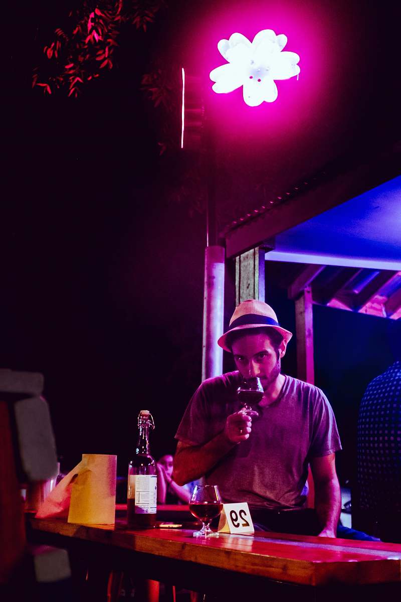 human man wearing grey shirt holding wine glass clothing