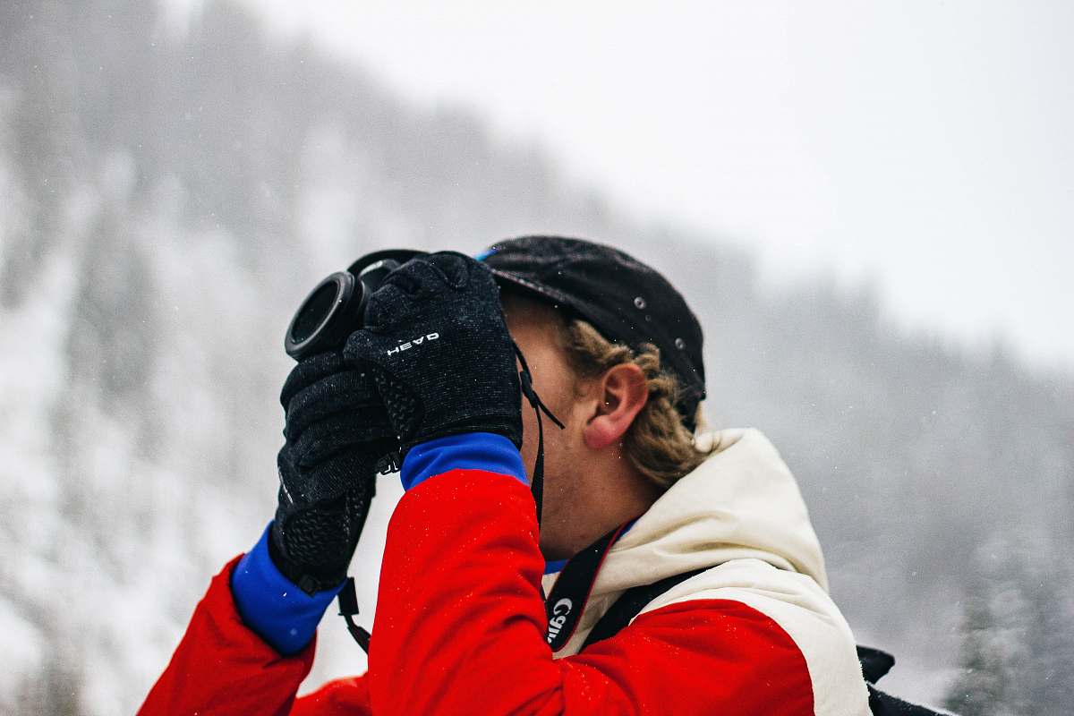 human person holding camera on snow field people