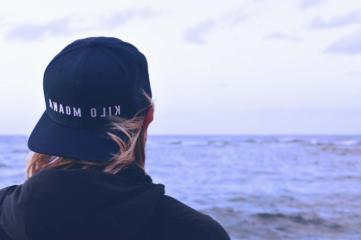 human person standing near body of water people