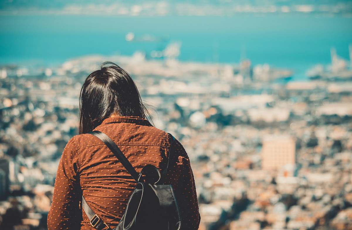 human shallow focus photography of woman in brown collared top during daytime people