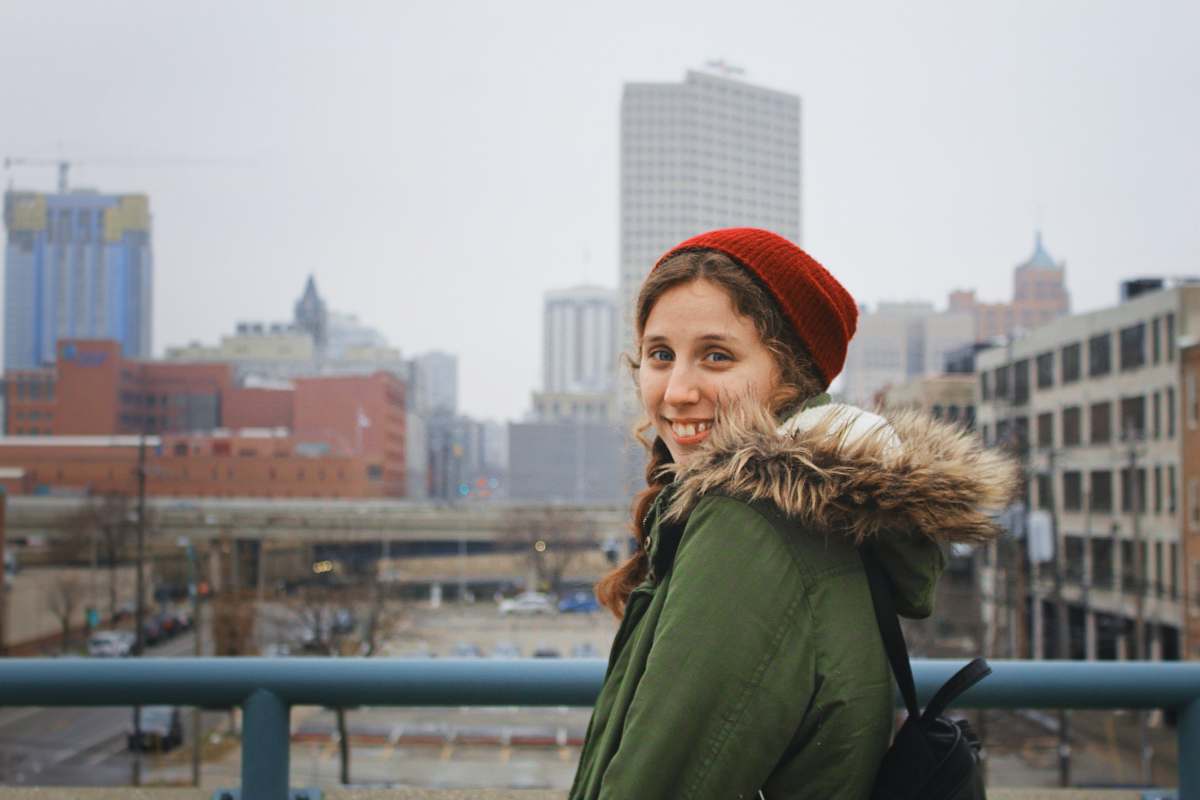 human woman standing on bridge during daytime people