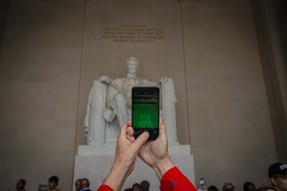 electronics person holding black smartphone cell phone