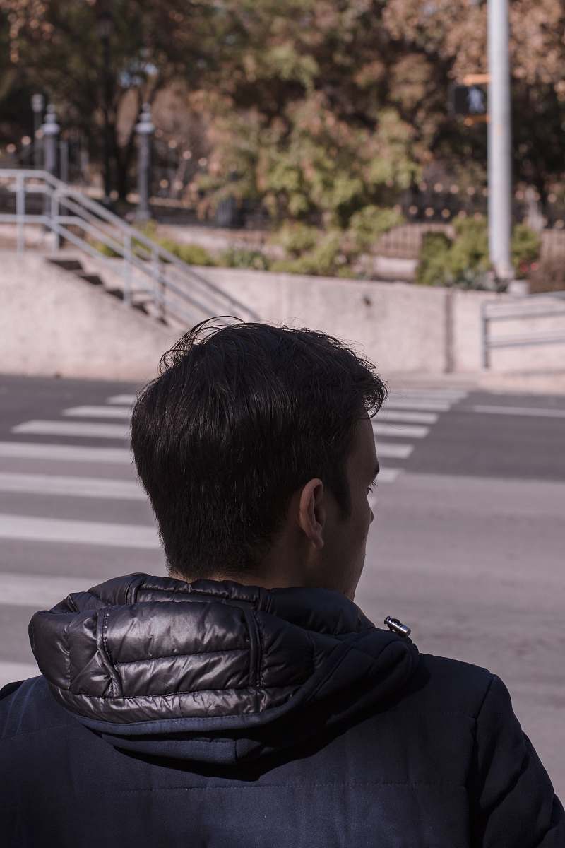 asphalt man standing in front of road tarmac