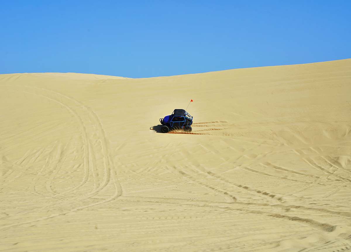 dune blue dune buggy on the desert desert