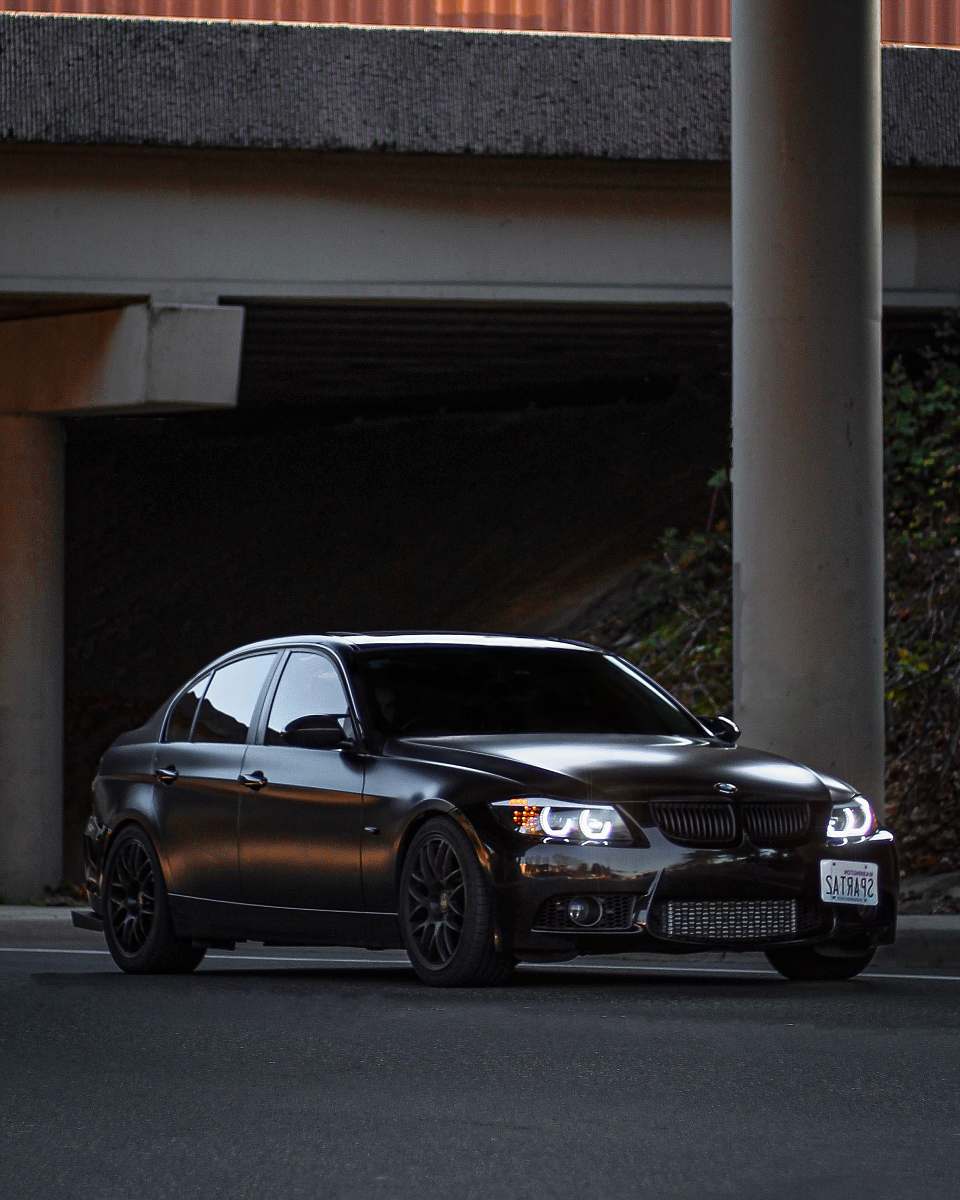 vehicle shallow focus photo of black BMW sedan car